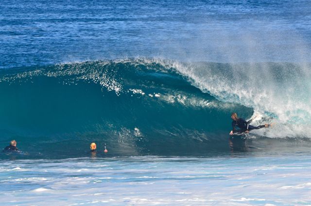 Sam in the barrel as Cohen and Callum look on